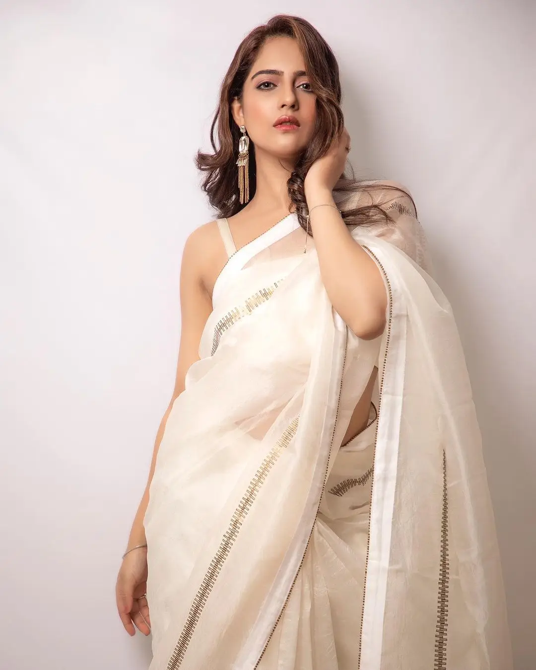 Malvi Malhotra Stills in White Saree Sleeveless Blouse